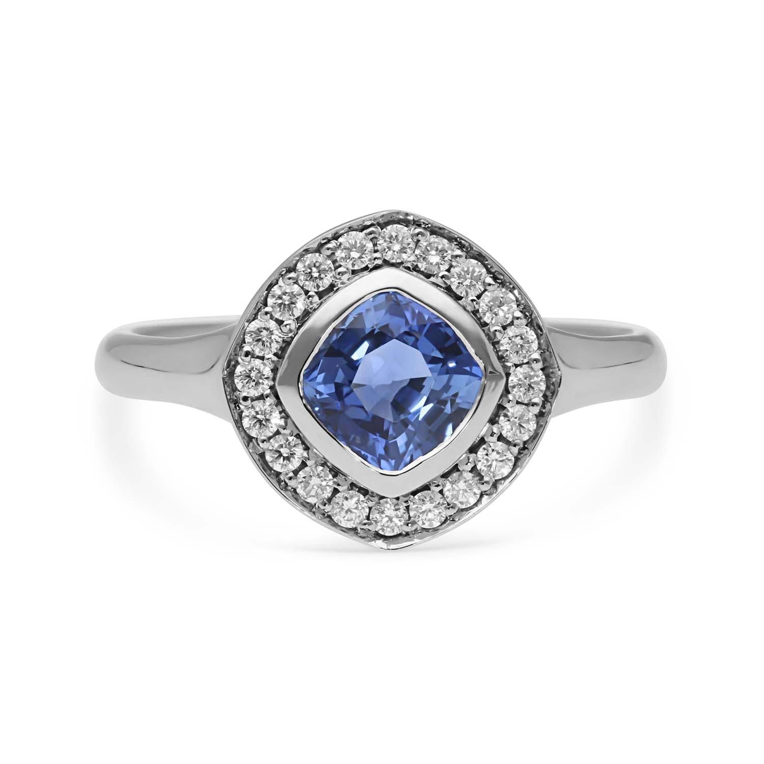 FRAME Platinum Cushion Blue Sapphire Ring with Diamond Halo by ethical jewellers E.C.One London, made in our B Corp London workshop