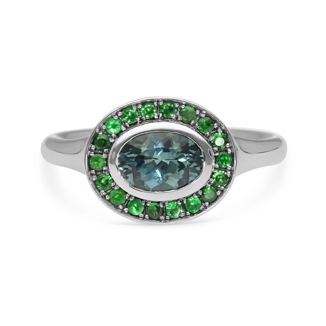 FRAME Platinum Oval Teal Sapphire Ring with Tsavorite Halo by ethical jewellers E.C.One London, made in our B Corp London workshop