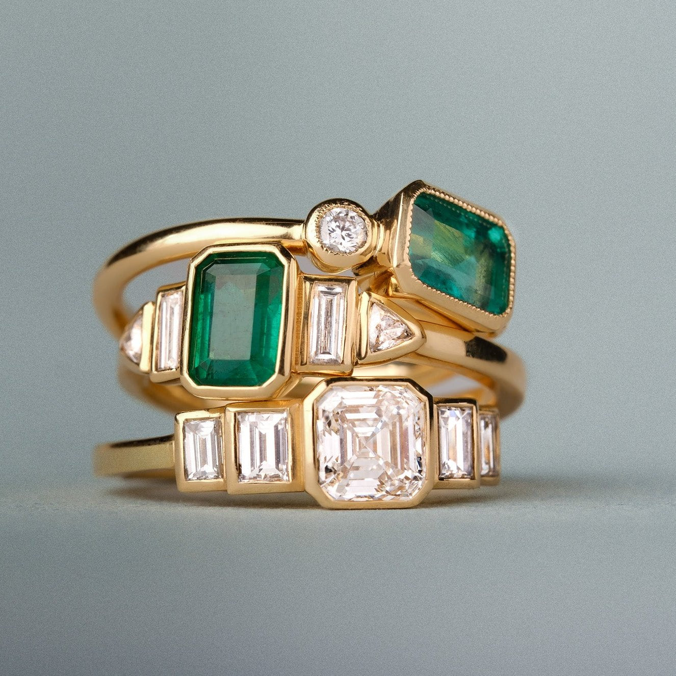 Daphne deco inspired emerald and diamond engagement ring in recycled yellow gold by EC One London