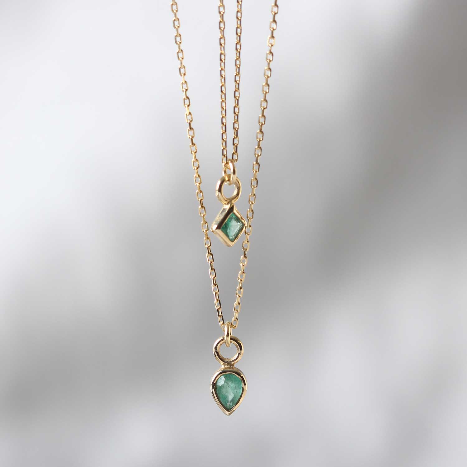 Metier Princess Cut and Pear cut Emerald Necklaces at EC One London